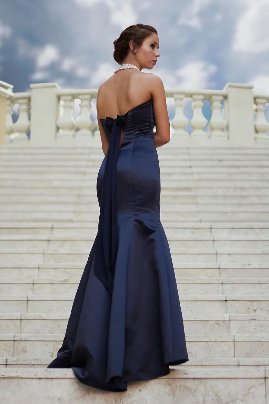 Reasons to Choose a Black Dress for Your Wedding woman standing female caucasian person girl gown formal steps1
